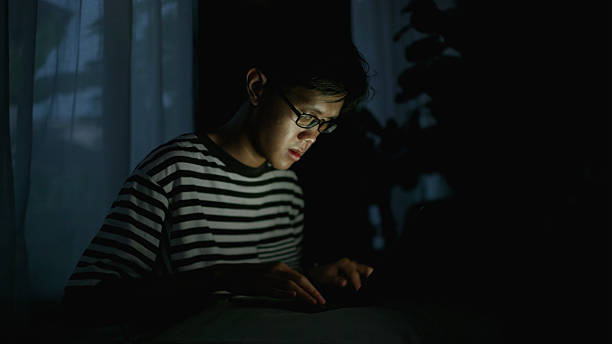 istock Working Before Bed – Man Using Laptop in a Dim Room. 4k 2223145094