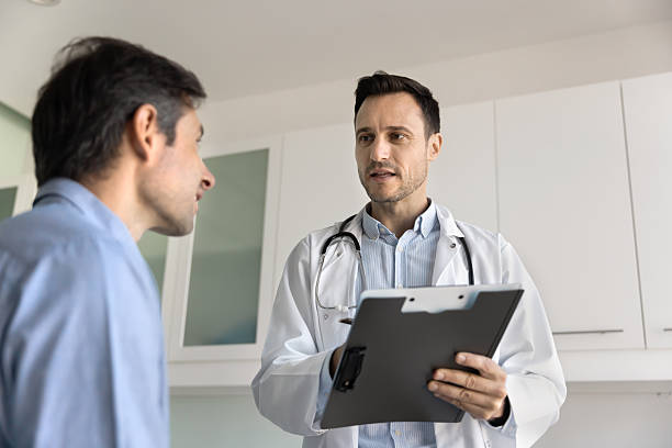istock Serious general practitioner, cardiologist man talking to patient 2223147432