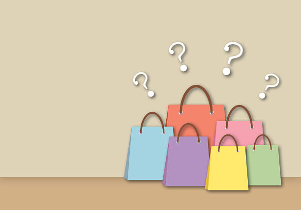 istock Colorful paper bags with many question mark on brown background. Concept for financial, spending and marketing problems, 2223148560