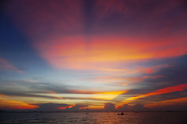 Nice sunset ray shine on clouds sky with sea background