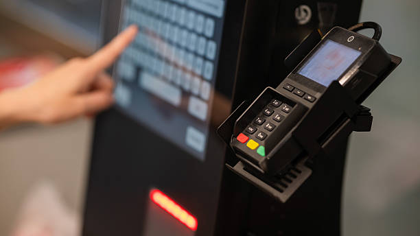 istock A woman uses a self-checkout machine. 2223152048