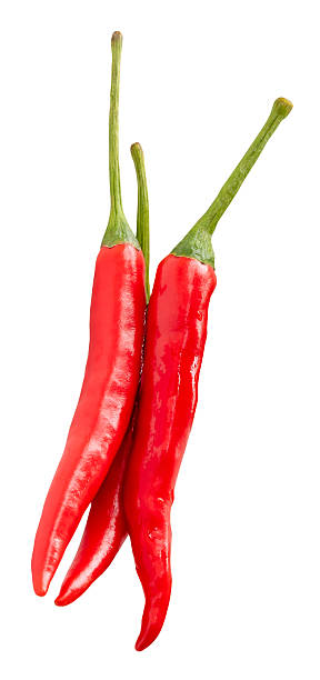 istock Top view of fresh red chili peppers or cayenne peppers in stack isolated on white background with clipping path 2223153131