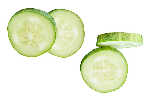 istock Top view set of fresh green cucumber slices in circle shape in stack isolated on white background with clipping path 2223153217