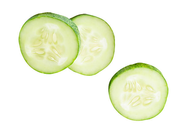 istock Top view set of fresh green cucumber slices in circle shape in stack isolated on white background with clipping path 2223153218