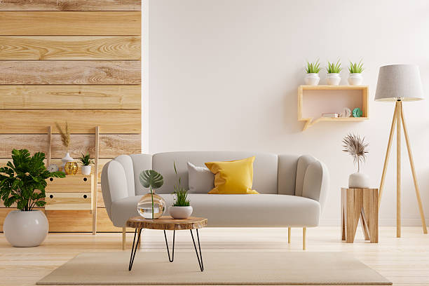 istock Bright and cozy living room interior featuring a light gray sofa with yellow and gray cushions, a round wooden coffee table, and decorative plants- 3D rendering 2223153442