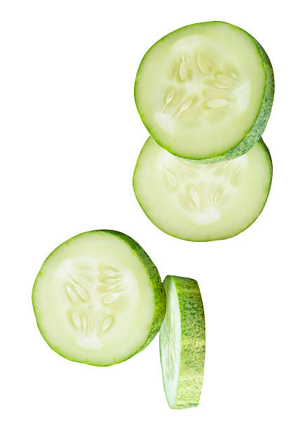 istock Top view set of fresh green cucumber slices in circle shape in stack isolated on white background with clipping path 2223153547