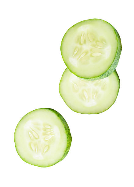 istock Top view set of fresh green cucumber slices in circle shape in stack isolated on white background with clipping path 2223153557