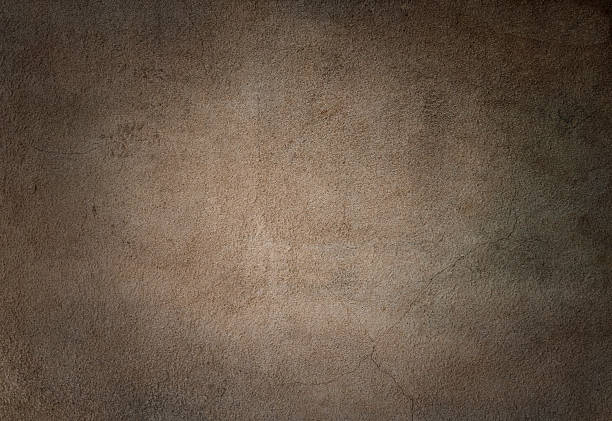Brown grunge concrete wall with cracks background.