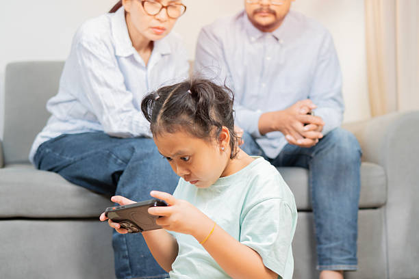 istock Child addicted smartphone. Screen time control, tech addiction in kids, digital parenting mobile gaming habits 2223161660