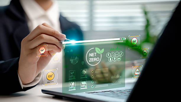 istock Businessperson analyzing net zero carbon dashboard hologram, showing CO2 emission data and sustainable energy icons, highlighting carbon reduction and environmental responsibility concept. 2223162619
