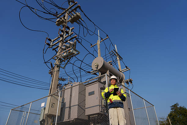 istock An expert engineer is inspecting a high-voltage transformer in a remote rural area.(Photo) 2223163129