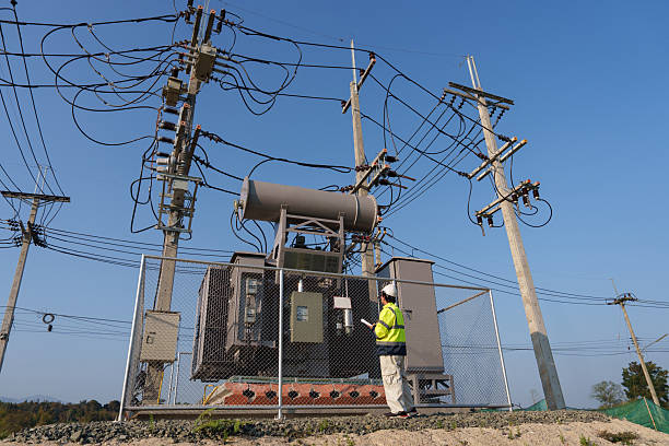 istock An expert engineer is inspecting a high-voltage transformer in a remote rural area.(Photo) 2223163133