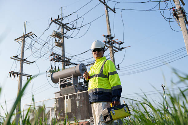 istock An expert engineer is inspecting a high-voltage transformer in a remote rural area.(Photo) 2223163328