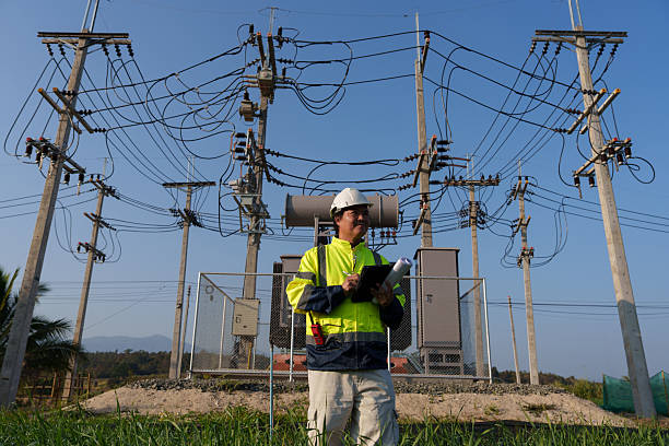 istock An expert engineer is inspecting a high-voltage transformer in a remote rural area.(Photo) 2223163412