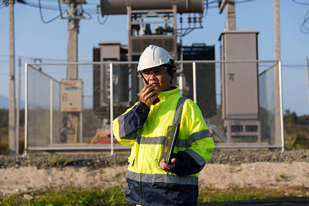 istock An expert engineer is inspecting a high-voltage transformer in a remote rural area.(Photo) 2223163451