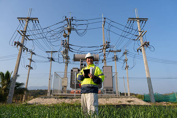 istock An expert engineer is inspecting a high-voltage transformer in a remote rural area.(Photo) 2223163461
