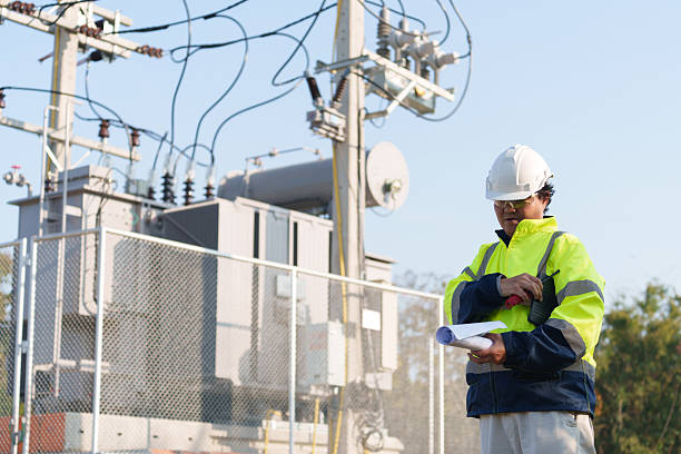istock An expert engineer is inspecting a high-voltage transformer in a remote rural area.(Photo) 2223163633
