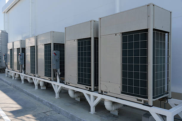 istock Air compressor or air condenser unit located on support outside building to heat released transferred to surrounding environment, Compressor is part of cooling function and air conditioning 2223163788