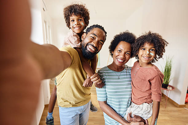 istock Happy black family taking a selfie during home renovation process. 2223165803