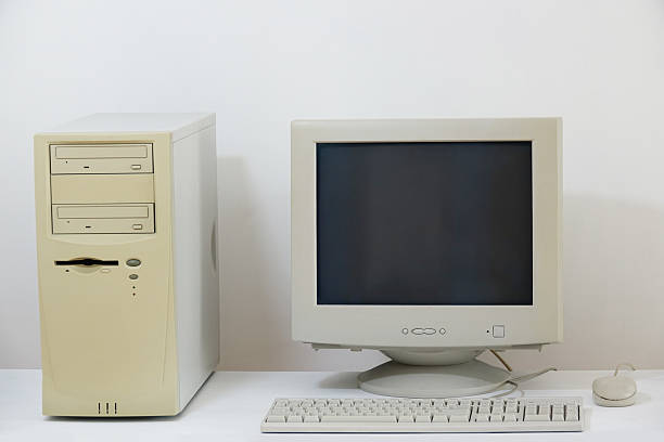 Old personal computer. The system unit, CRT monitor, keyboard and mouse isolated on white background.