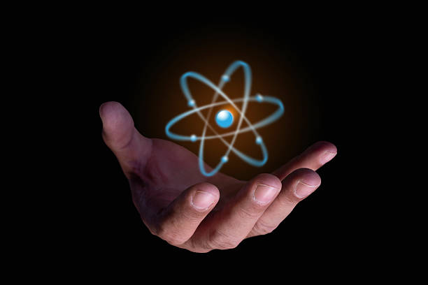 istock Businessman hand holding creative atom. Nuclear fusion concept, endless energy, future technologies. Science and future concept. Power and innovation concept. Scientific study and exploration 2223172726
