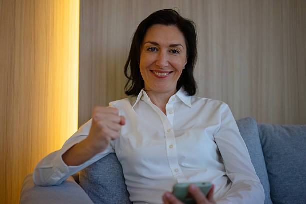 istock Female white collar worker is using smart phone. 2223173133
