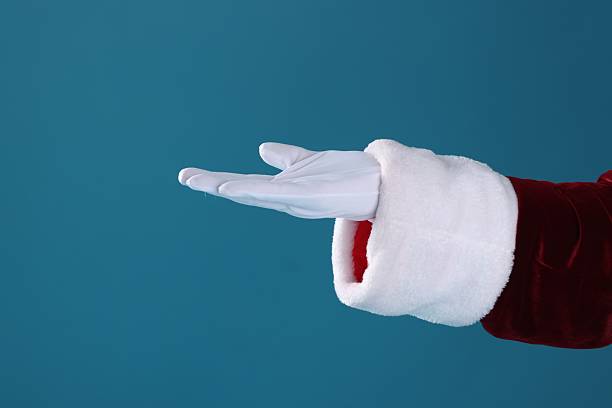 istock Santa Claus holding something on blue background, closeup 2223173230