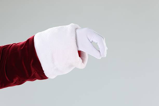 istock Santa Claus holding something on gray background, closeup 2223173395