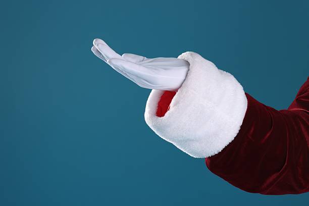 istock Santa Claus holding something on blue background, closeup 2223173435