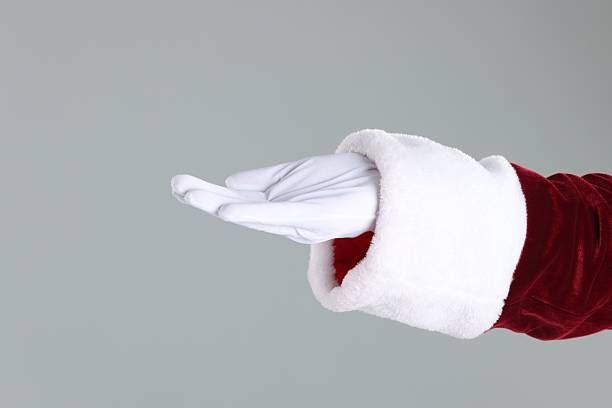 istock Santa Claus holding something on gray background, closeup 2223173497