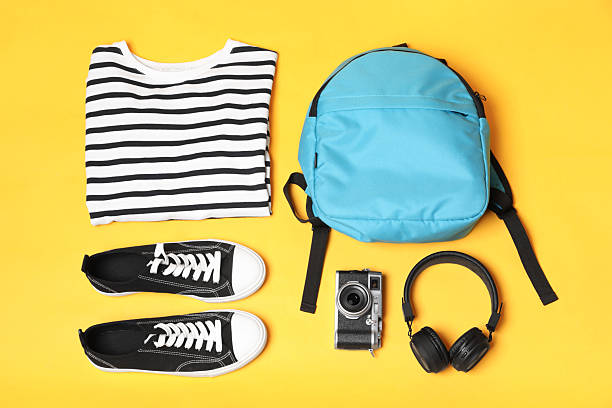 istock Stylish outfit with backpack on yellow background, flat lay 2223174142