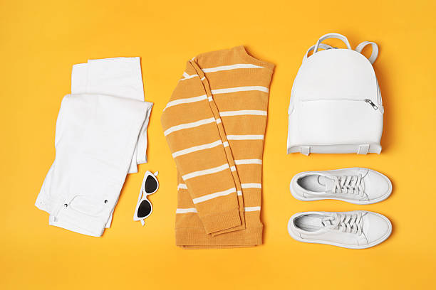 istock Stylish outfit with backpack on yellow background, flat lay 2223174179