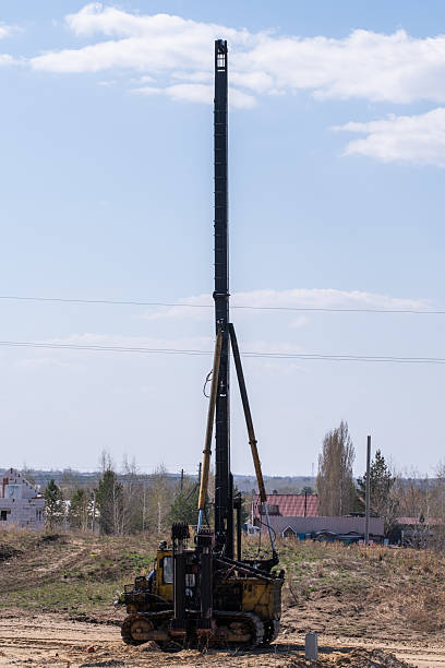 istock Machine for driving piles in ground in field. 2223174231