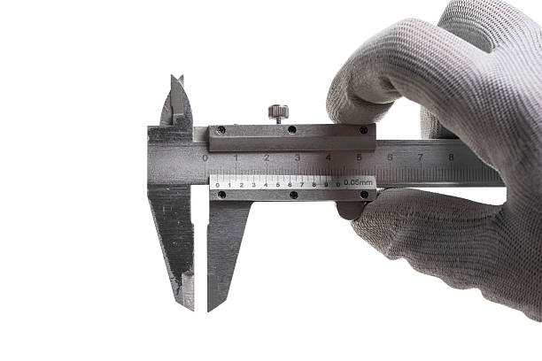 istock Caliper in hand master in gray gloves on white background. 2223174292