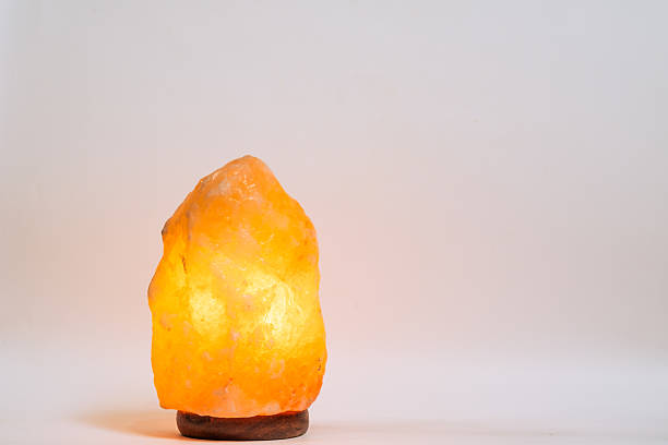 istock Himalayan salt lamp on white background with copy space. 2223174311