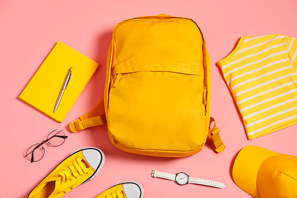 istock Stylish outfit with backpack on pink background, flat lay 2223175164