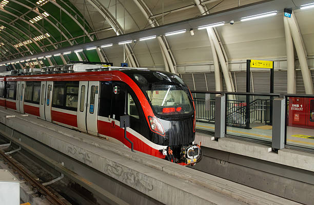 istock Modern LRT Train Arriving at Public Station – Driverless Fully Automatic Transit System 2223175209