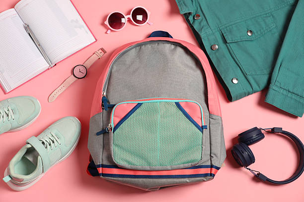istock Stylish outfit with backpack on pink background, flat lay 2223175226
