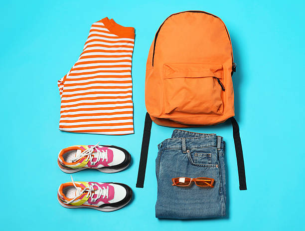 istock Stylish outfit with backpack on light blue background, flat lay 2223175228