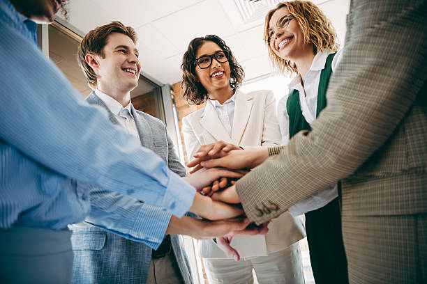 istock Team of professionals in a modern workplace shows camaraderie and support through teamwork building activities 2223176344