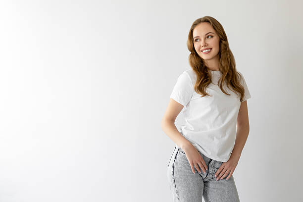 istock Gorgeous woman posing with hands in pockets 2223176815