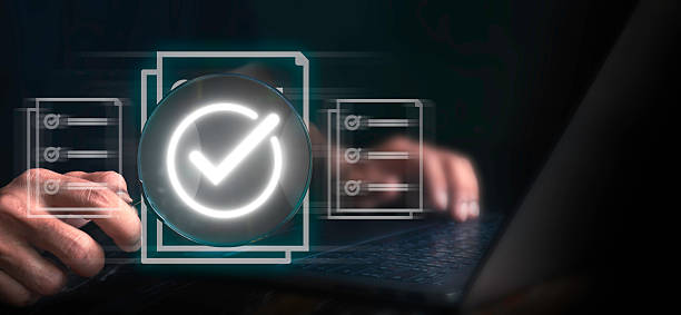 istock Man using laptop holding magnifying glass checking digital form, warranty, online filling service, document management system, online document database and file management process. 2223177559