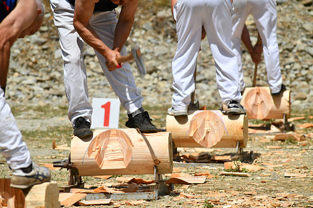 Competitors in the underhand woodchop event celebrating the 150th anniversary of the founding of Nelson Creek, New Zealand