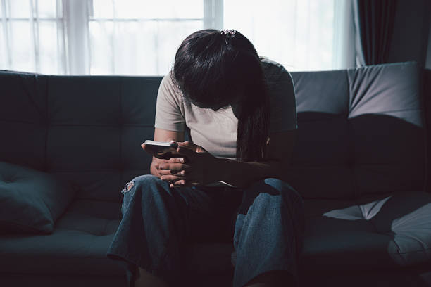 istock Sorrowful woman sat alone, overwhelmed by emotion, her sad and unhappy expression revealing deep despair, stress and distress left feeling depressed. sorrowful sad, despair alone, depressed stress 2223184190