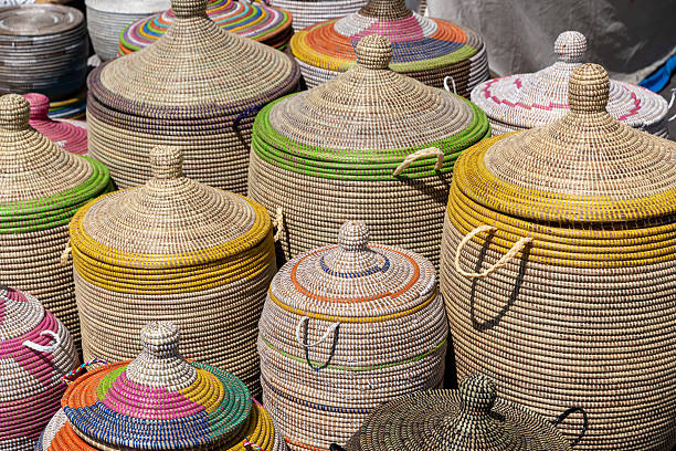 Germnay, Berlin, Kreuzberg, June 28, 2025 - Woven storage baskets for sale at a market stall