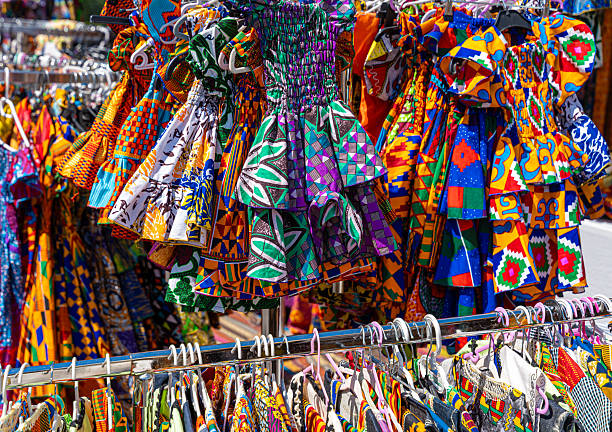 Germnay, Berlin, Kreuzberg, June 28, 2025 -Multi-colored women's dresses on hangers at a market stall
