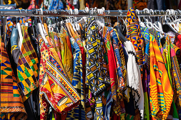 Germnay, Berlin, Kreuzberg, June 28, 2025 -Multi-colored women's dresses on hangers at a market stall