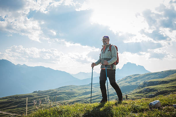 istock Mature man with backpack hiking at Dolomite 2223189483