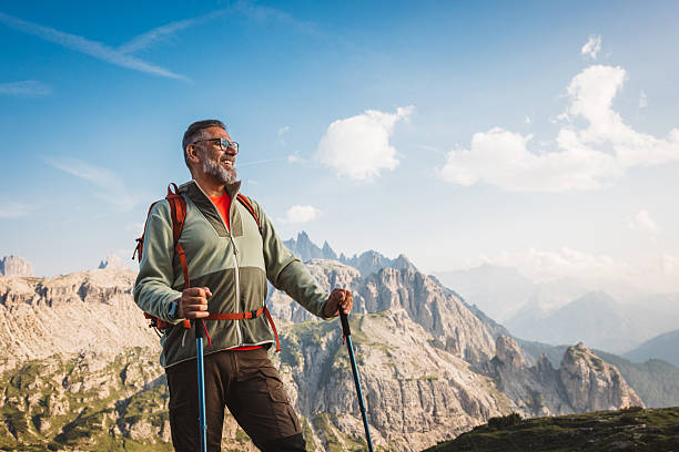 istock Mature man with backpack hiking at Dolomite 2223189649
