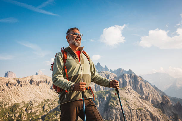 istock Mature man with backpack hiking at Dolomite 2223189689